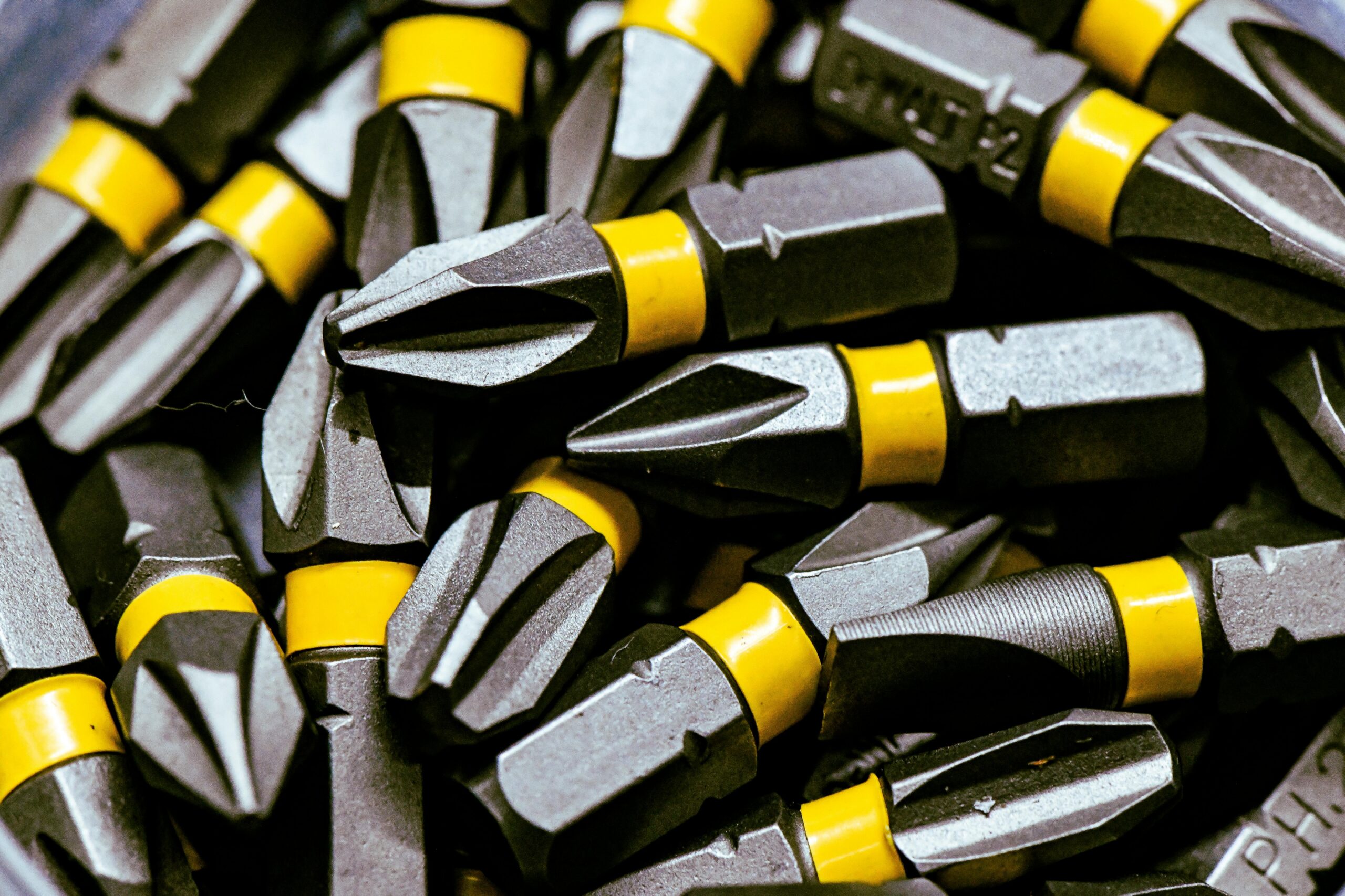 pexels photo 30738885 30738885 Detailed image of steel screwdriver bits with yellow bands.